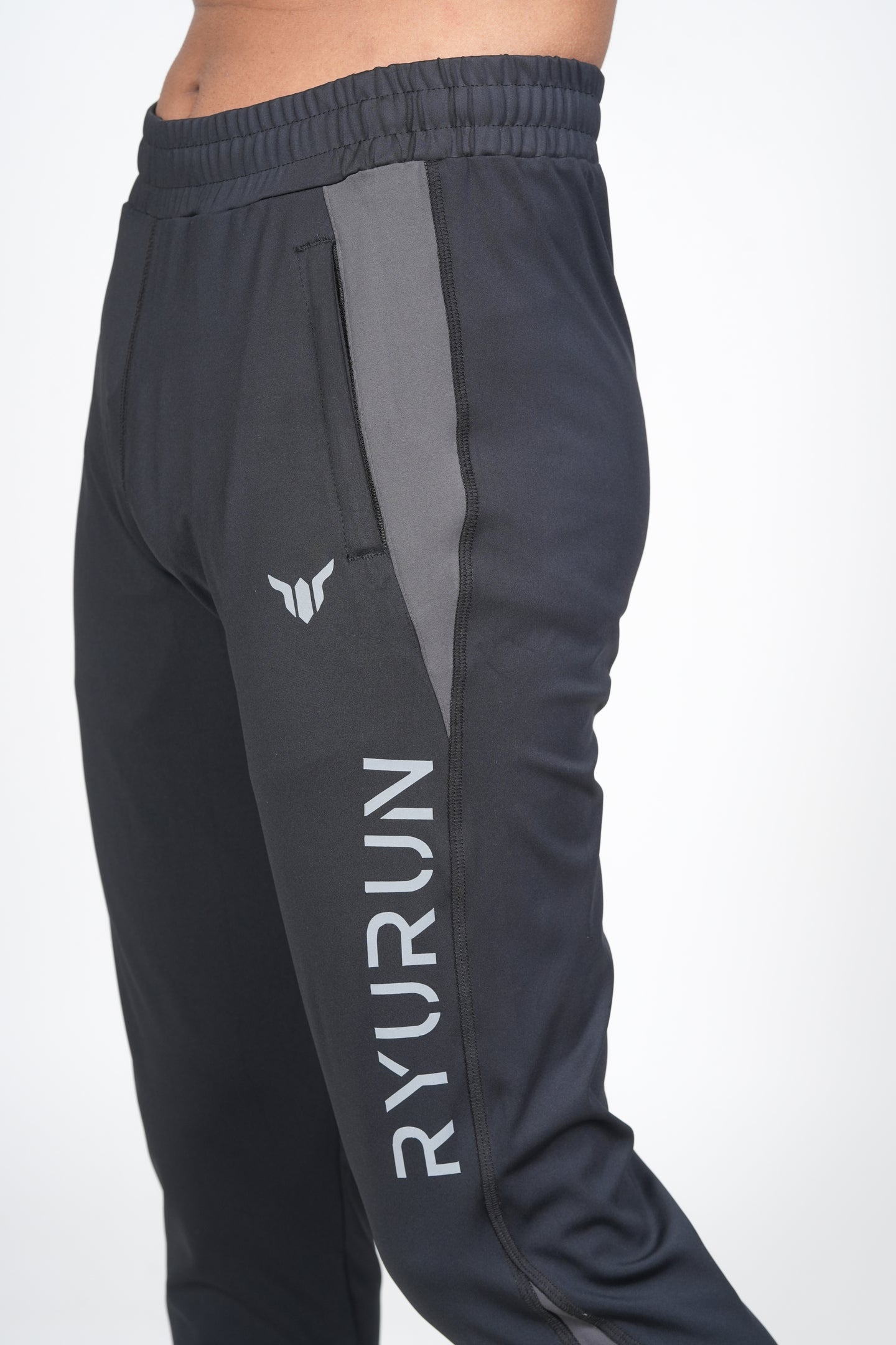 Men's Black Track Pant – Side View Highlighting Pocket and Panel Design