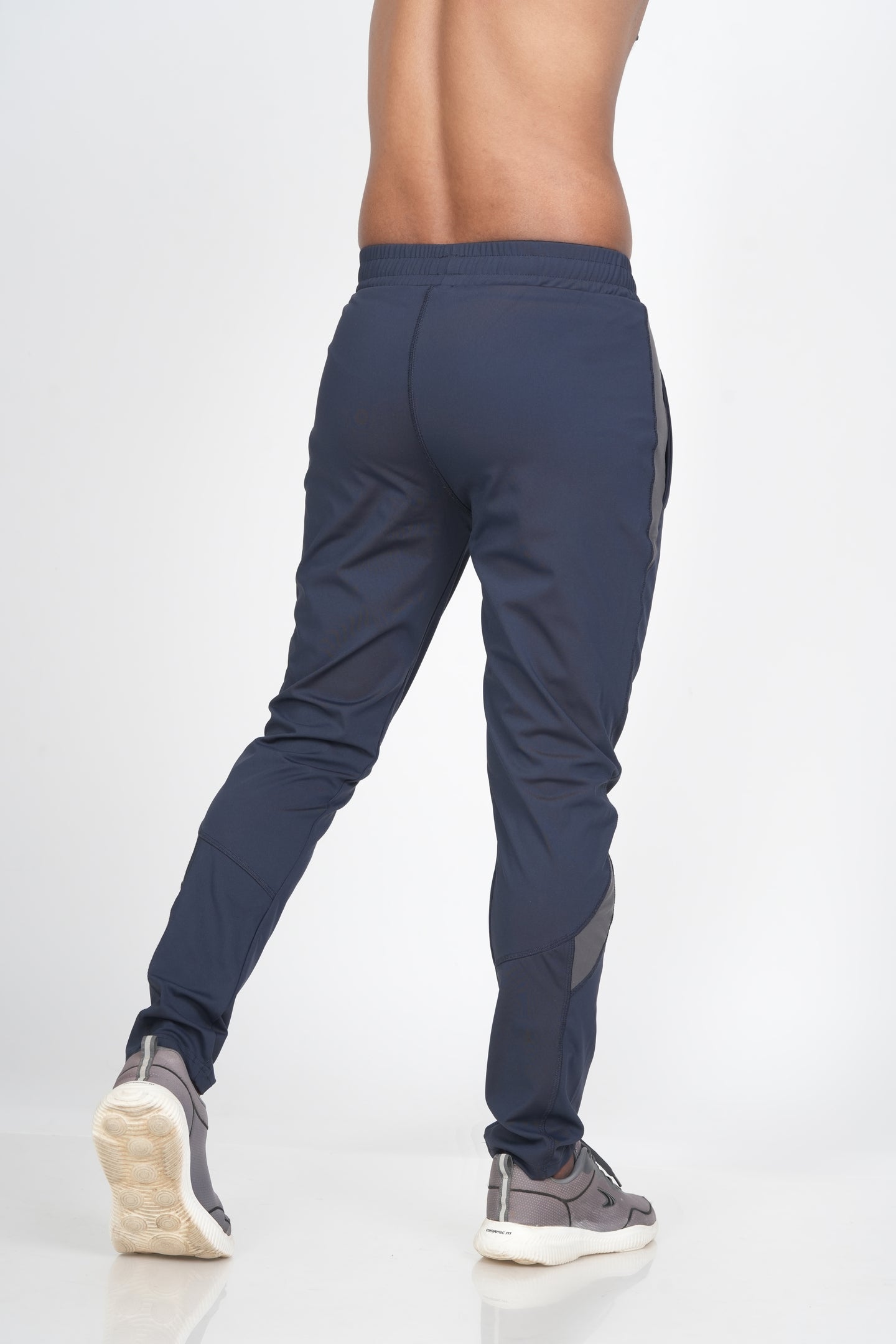 Men's Blue Track Pant – Back View Highlighting Tapered Fit and Fabric Fall