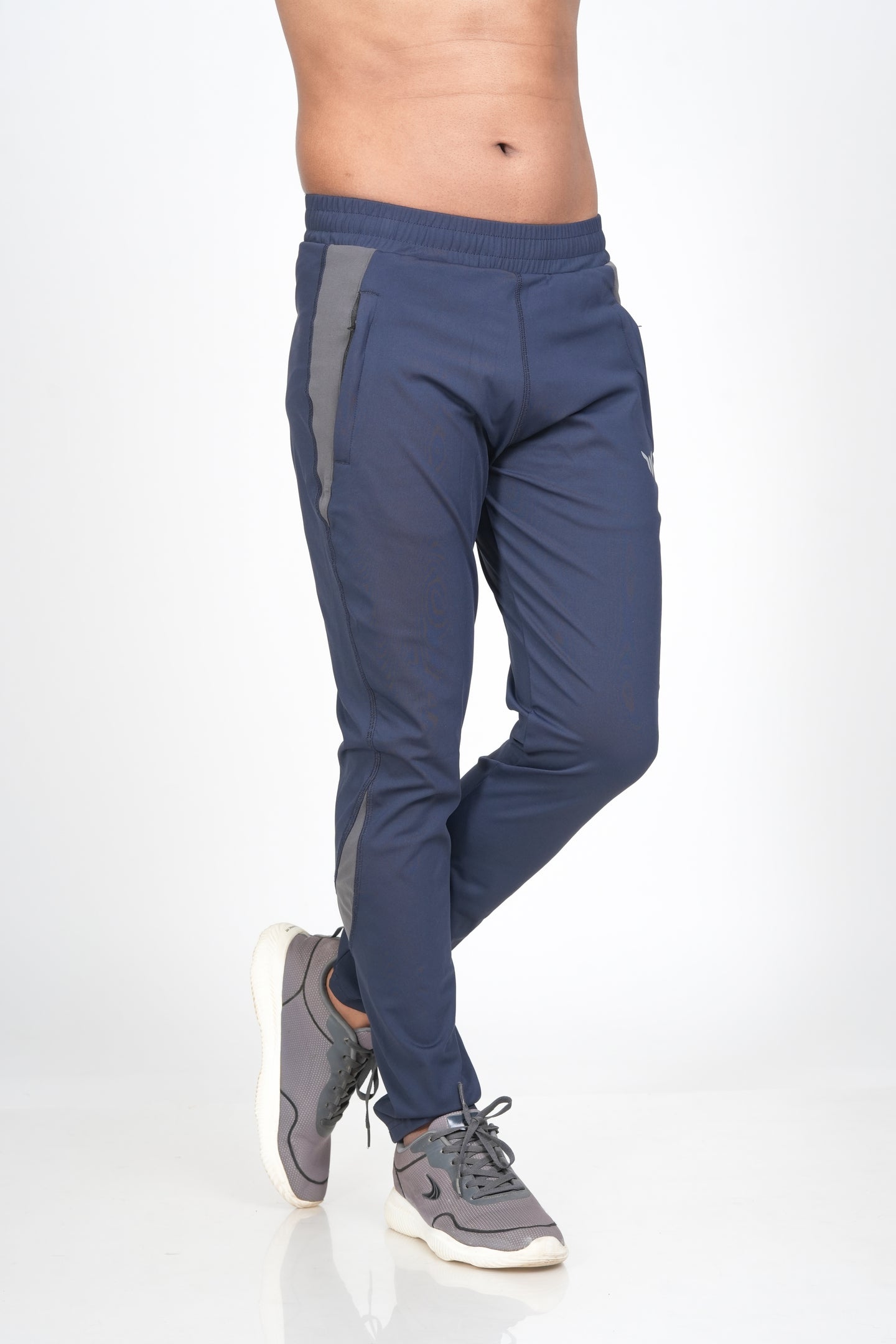 Men's Blue Track Pant – Side View Showing Pocket and Streamlined Silhouette