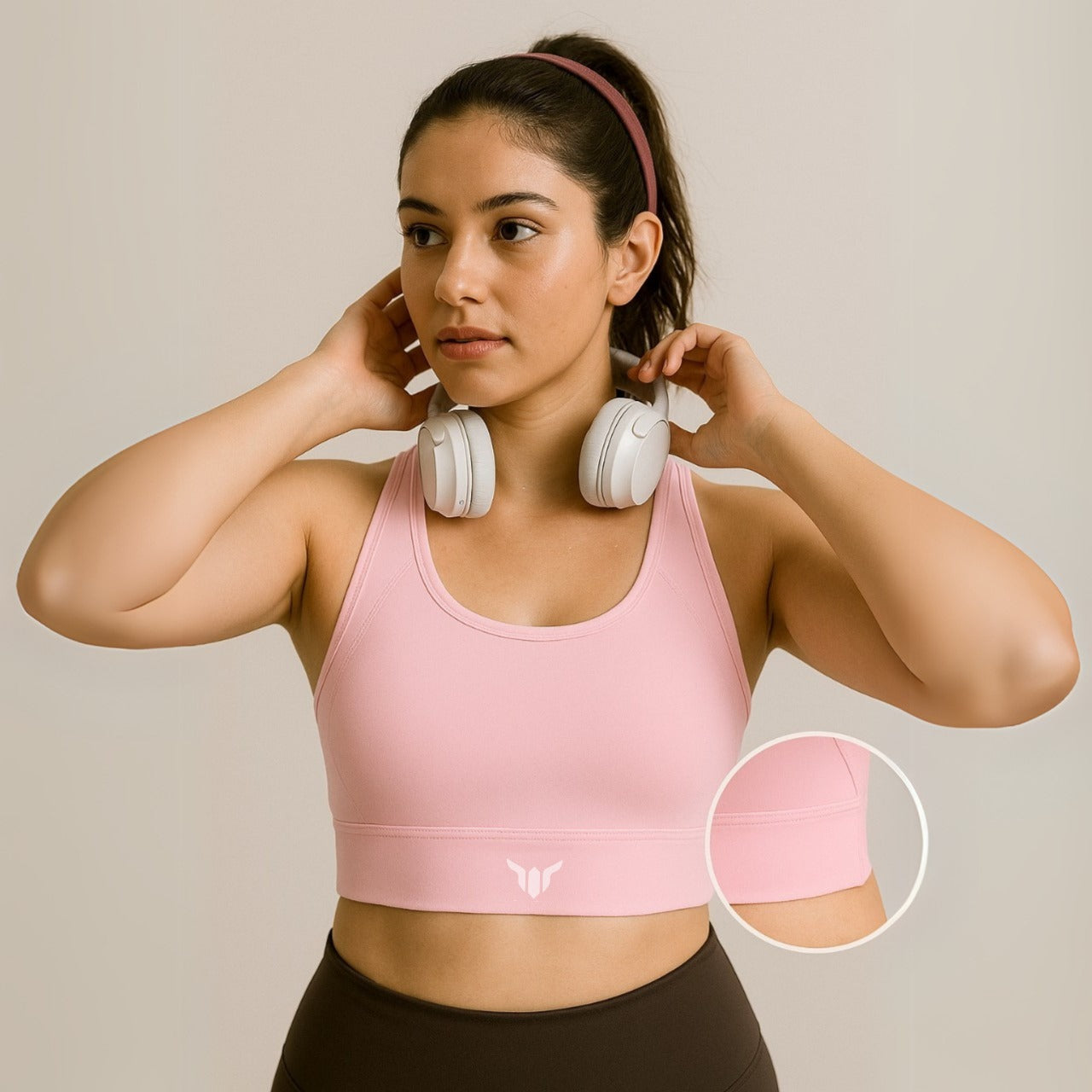 Women's Baby Pink Sports Bra – Front View with Model Highlighting Chest Fit, Lifted Shape, and Sculpted Silhouette
