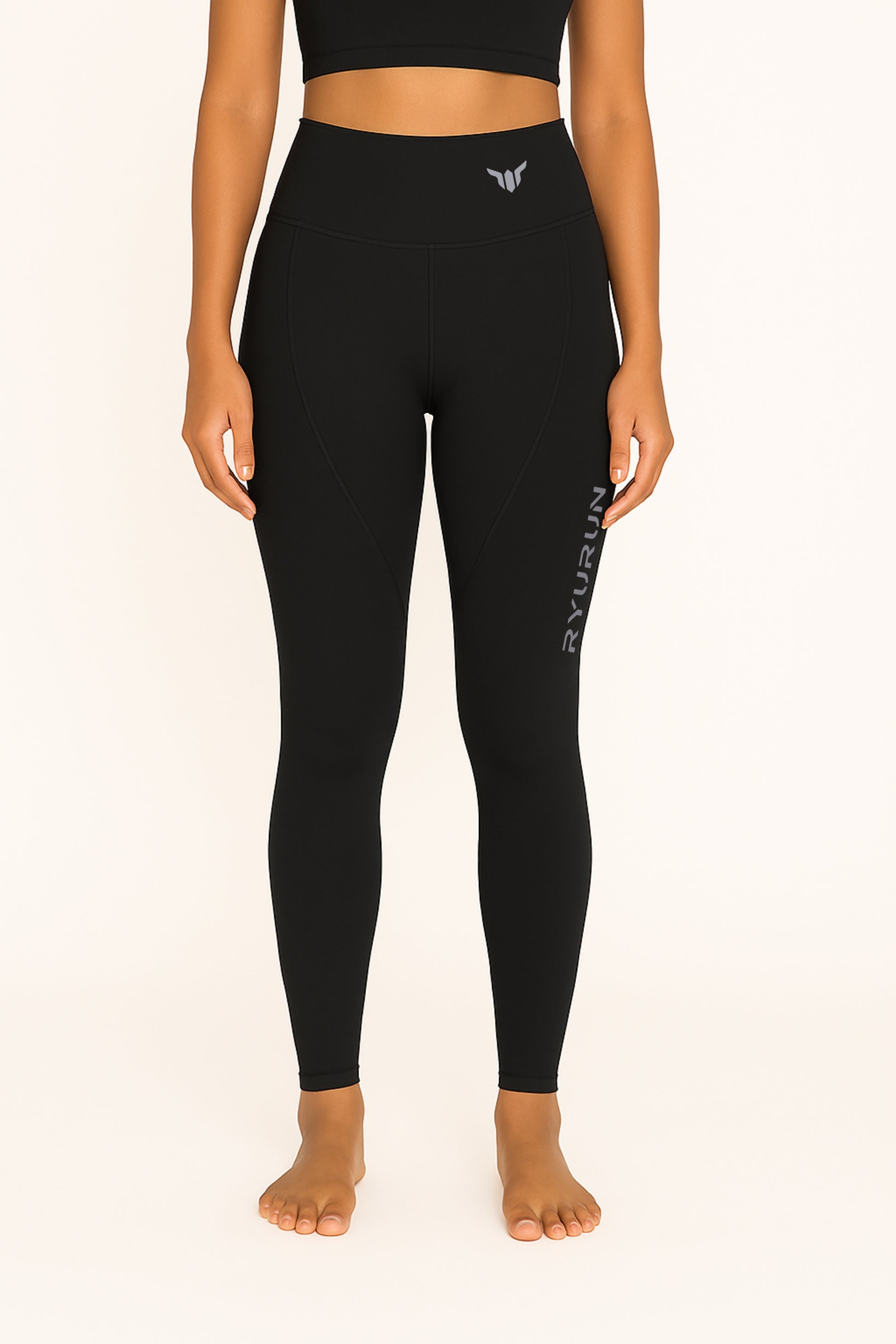 Women's Black Leggings – Front View with Model Highlighting High-Rise Waist and Smooth Front Panel
