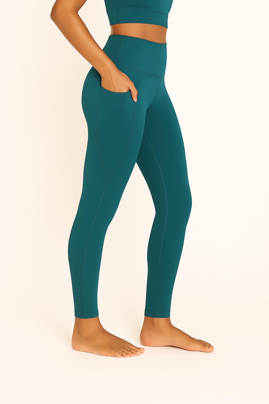 Women's Emerald Green Leggings – Right Side View Displaying Fabric Flow, Side Seam, and Tapered Ankle