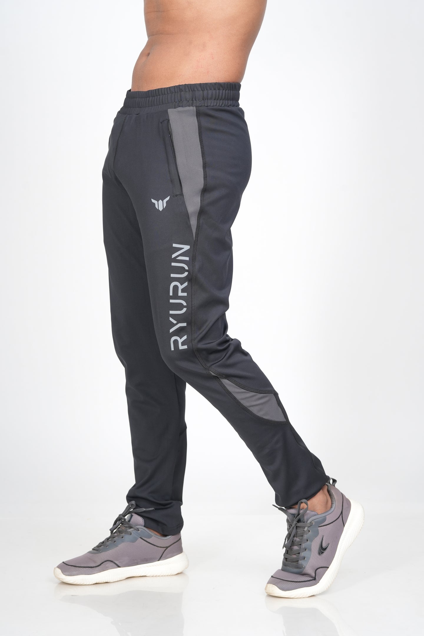 Men's Black Track Pant – Side View Highlighting Pocket and Shape Shift Design