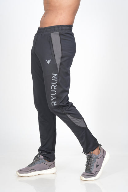 Men's Black Track Pant – Side View Highlighting Pocket and Shape Shift Design
