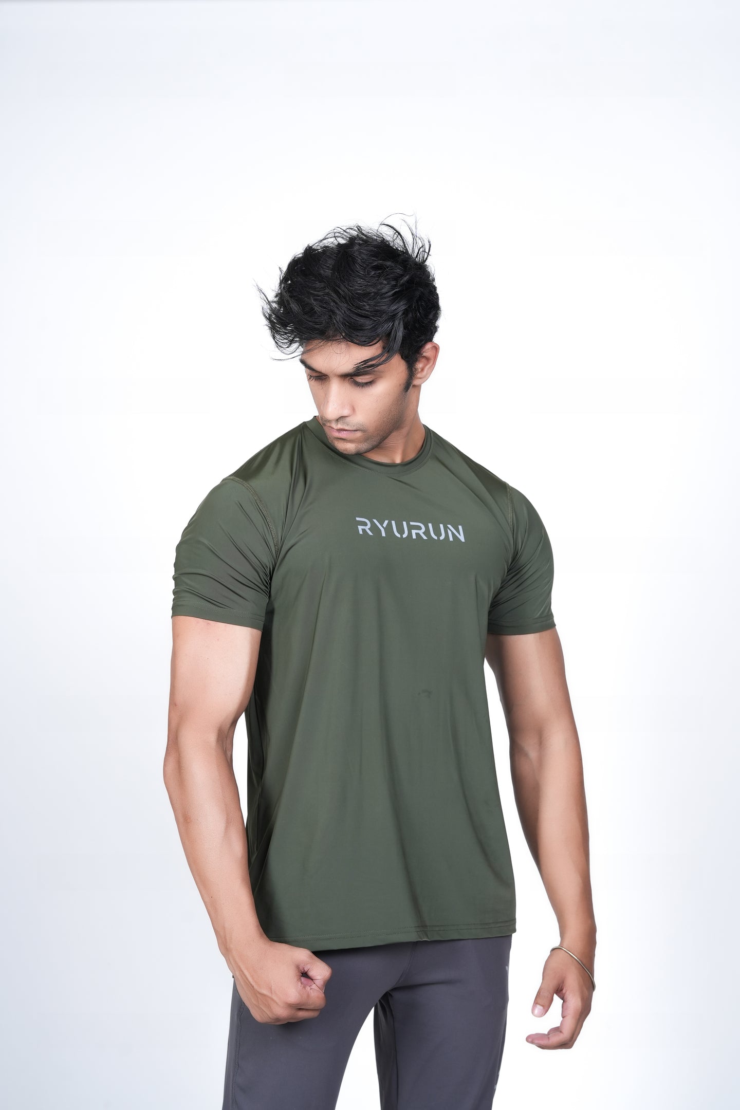 Men's Olive Green T-Shirt – Angled Front Pose Highlighting Side Hem and Shoulder Fit