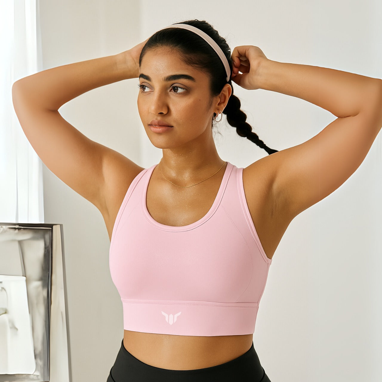 Women's Baby Pink Sports Bra – Close-Up Showing Ribbed Neckline, Texture, and Soft Compression Material

