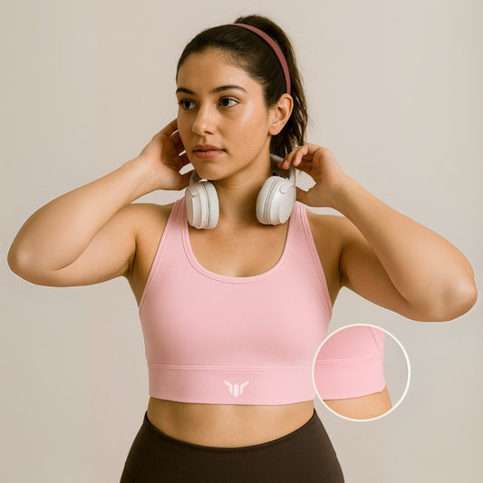 Women's Baby Pink Sports Bra – Front View with Model Highlighting Chest Fit, Lifted Shape, and Sculpted Silhouette