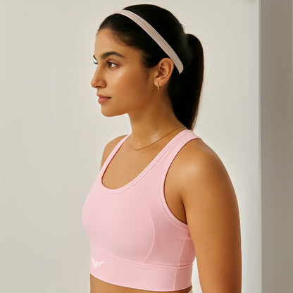 Women's Baby Pink Sports Bra – Side View Showing Underarm Curve, Side Contour, and Stretch Fabric Hold