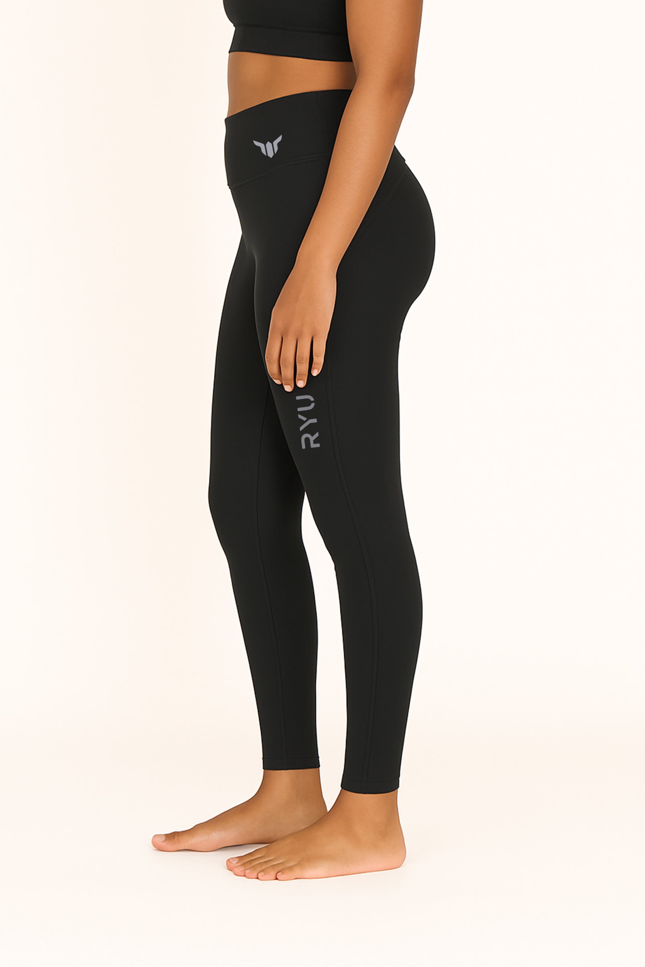 Women's Black Leggings – Left Side View Displaying Hip Support, Side Contour, and Seam Design

